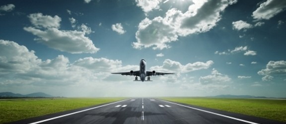 Plane taking off clouds runway